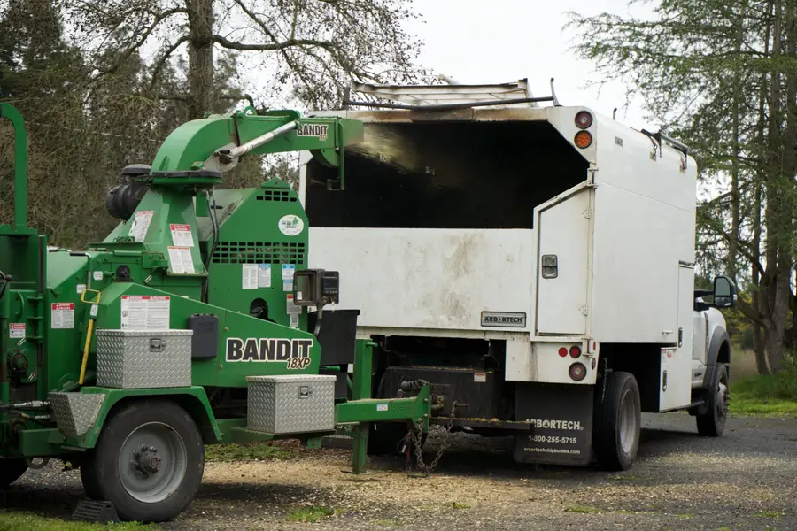 Bandit chipper hooked to a TreeEx chip truck