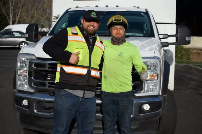 TreeEx crew giving a thumbs up on the job